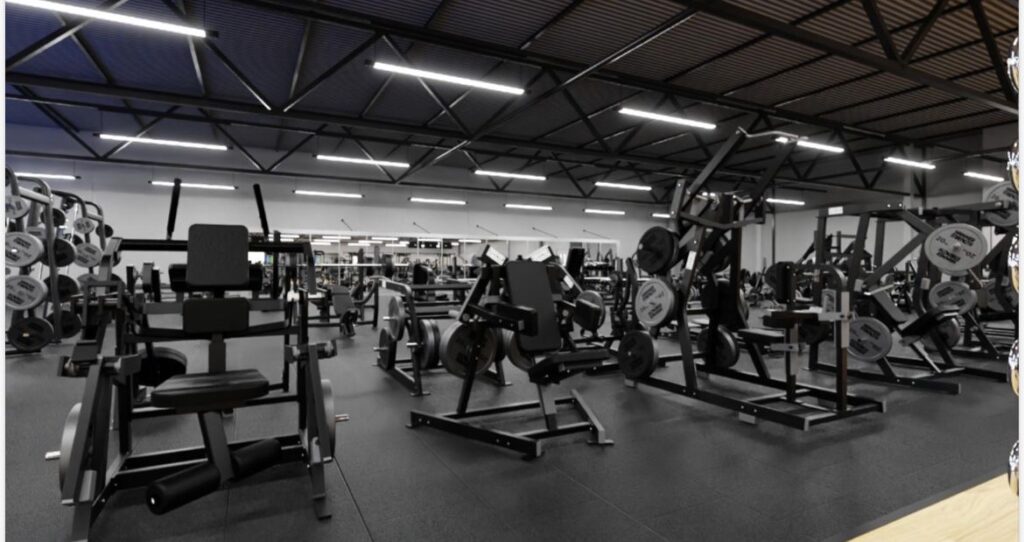 a large gym with many exercise equipment