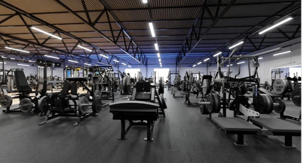 a large gym with weights and machines