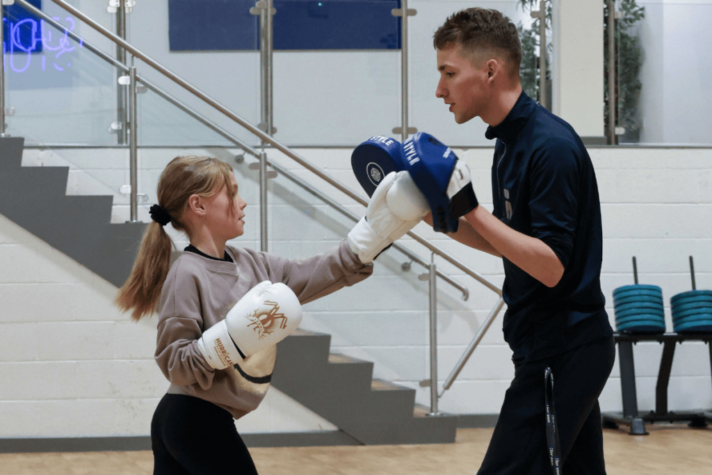 Coach and THRIVE member sparring in our THRIVE Boxercises class