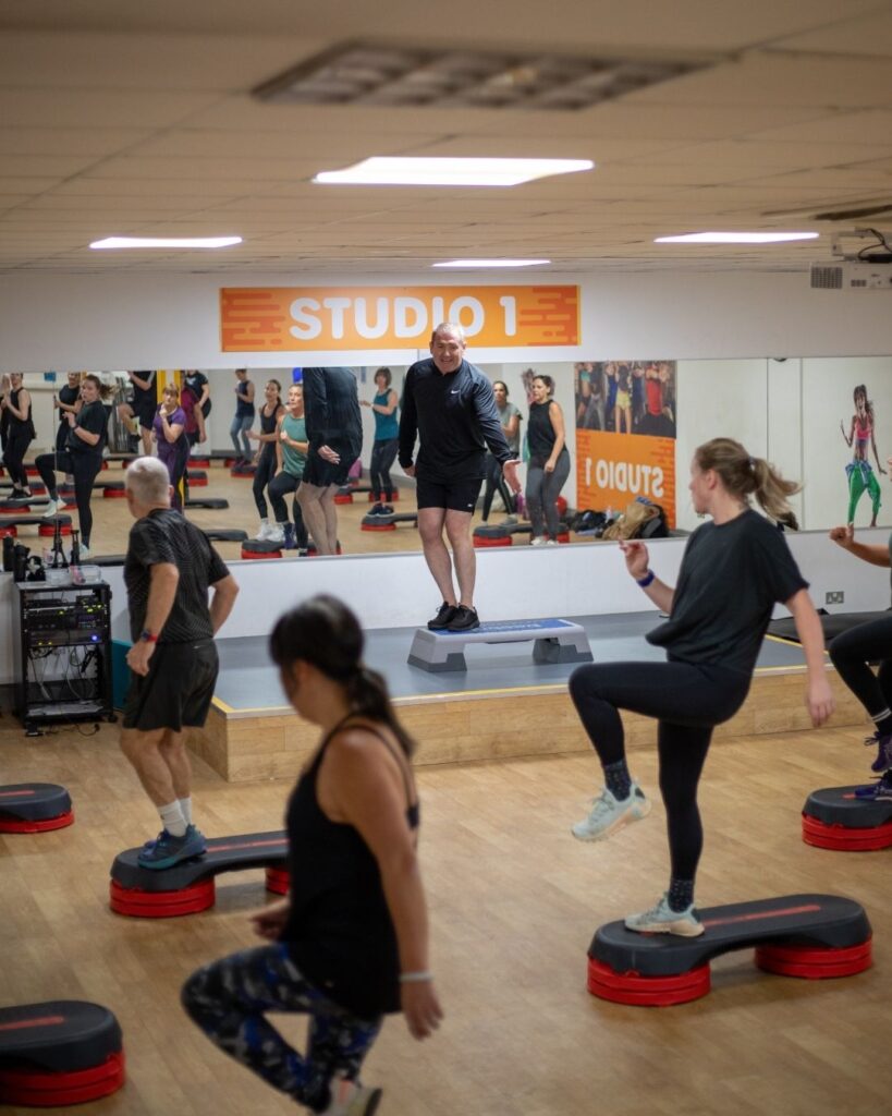 Group exercising in a fitness studio for National Fitness Day