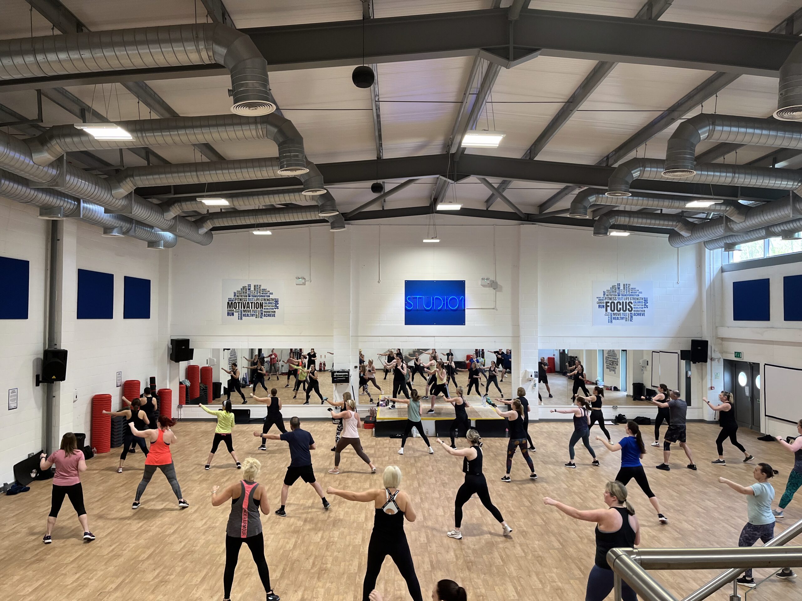 Group exercise class in spacious studio for immunity
