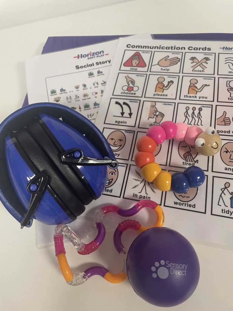Sensory toys and communication aids displayed.