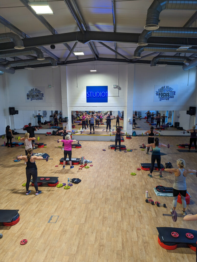 Group les mills classes fitness class in a studio