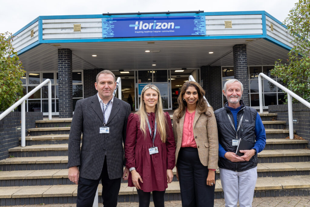 Group photo outside Horizon building entrance suella braverman.