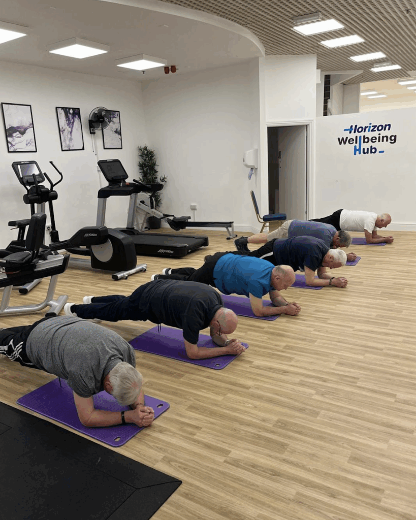 Elderly men exercising in a gym mental health benefits