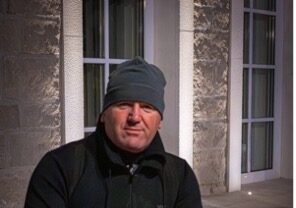 Man holding a bright swim bag for ultra swim 33.3