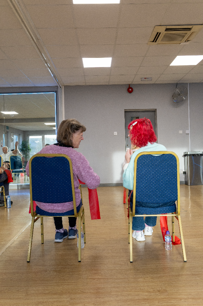 Two women sitting on chairs mental health awareness